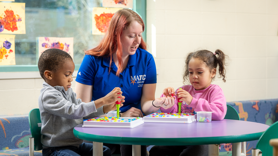 MATC caregiver with two children